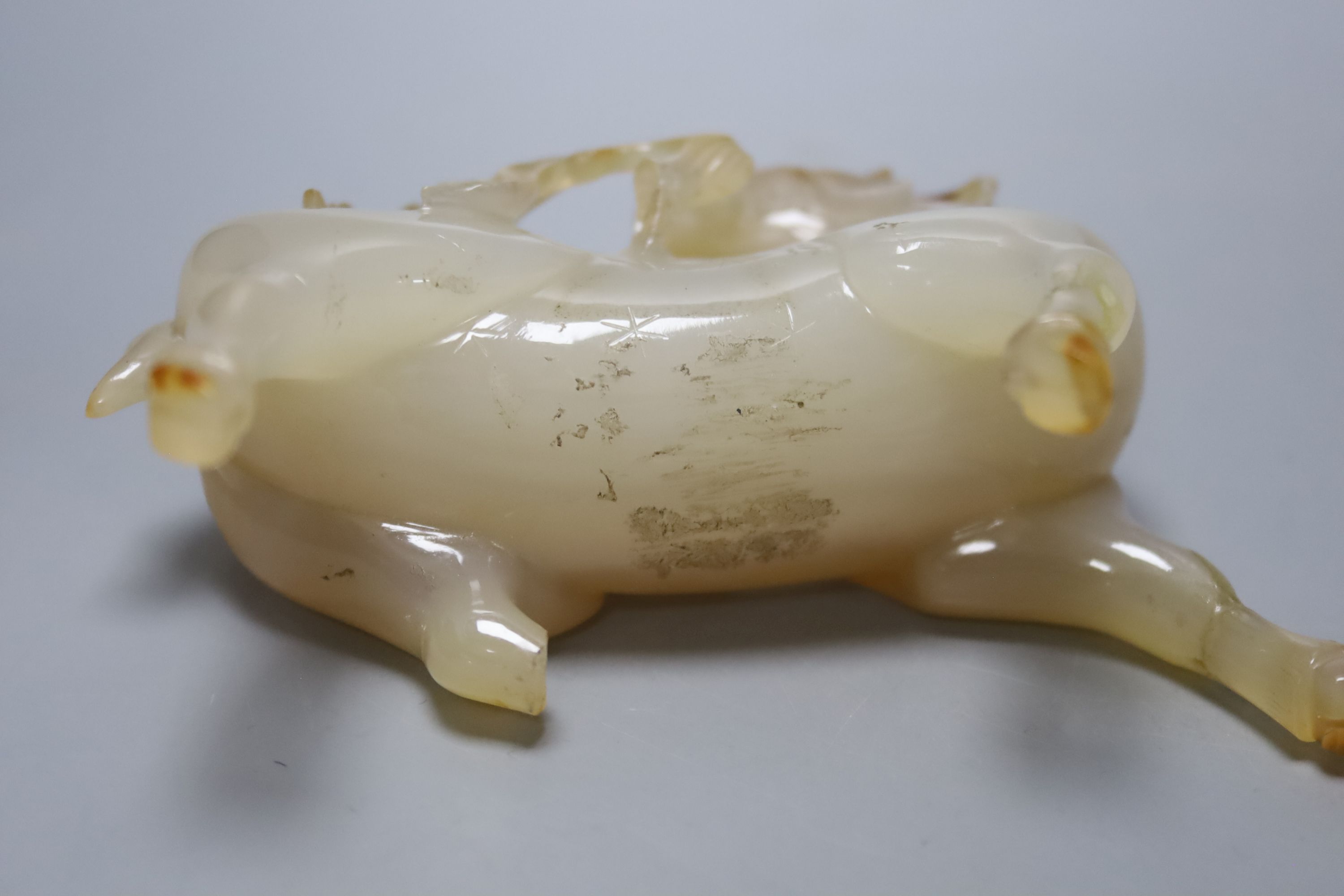 A 19th century Chinese carved jade brushwasher together with an agate figure of a stag, tallest 11cm